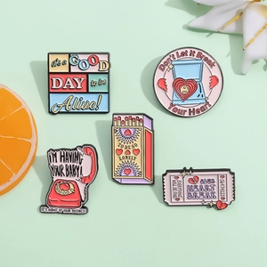 Set of 5 colorful retro enamel pins featuring vintage telephone and matchbox designs