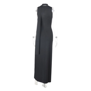 Detail view of backless black knit maxi dress with elegant long neck ribbons and metal hardware