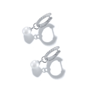 Macro detail of elegant silver pearl drop earrings with sparkling pavé crystals