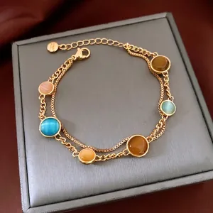 Vintage 18k gold plated double chain bracelet featuring colorful round cat eye stones