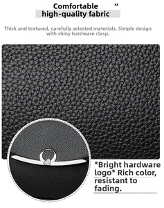 Detail showing black lychee grain leather texture and silver heart rhinestone buckle