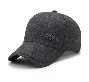 Close-up of embossed RZG logo and stars on a textured grey baseball cap fabric