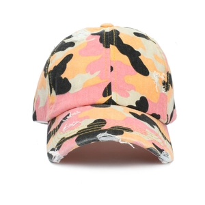Detail of distressed ponytail baseball cap with pink camo pattern and washed finish