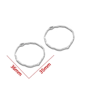 Detailed view of irregular silver heart charms showing 36mm and 35mm dimensions