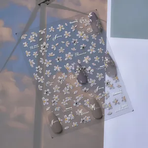 Detailed 5D embossed white pear flower nail stickers with crystal accents on matte grey tips
