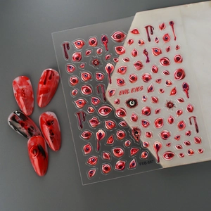Detailed 5D embossed Halloween nail stickers featuring red evil eyes and bloody droplets
