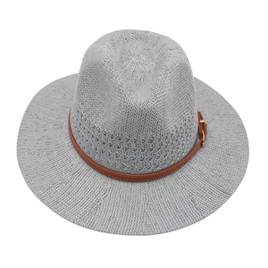 Detailed close-up of grey vintage panama hat with brown leather belt and gold buckle