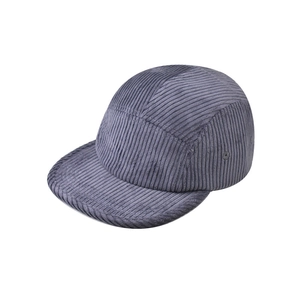 Detail view of the high-quality corduroy texture and flat brim of a 5-panel baseball cap