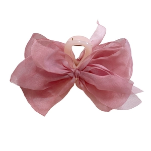 Elegant dusty pink tulle bow hair claw clip for women with a large layered mesh design