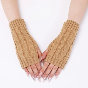 Close-up of camel knit fingerless gloves featuring classic thick cable stitch texture
