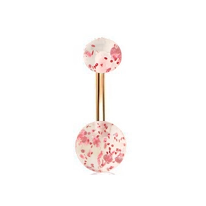 Macro detail of golden belly button ring with translucent spheres and pink glitter