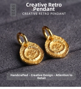 Macro shot of S925 sterling silver lotus charms with gold finish and vintage texture