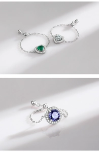 Macro detail of adjustable S925 sterling silver chain ring with heart and round cubic zirconia