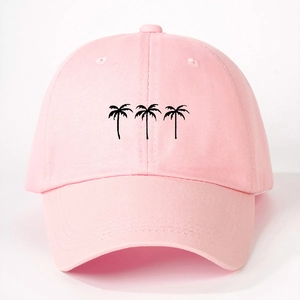 Detailed close-up of pink cotton twill baseball cap with black embroidered palm tree design