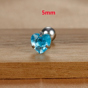 Macro shot of 5mm heart-shaped blue zircon stud earring with titanium steel base