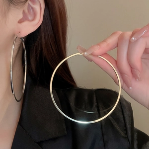 Minimalist large oversized hoop earrings with high polish gold and silver finish for women