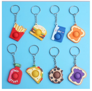 Close-up of silicone food-shaped fidget keychains including fries burger and toast