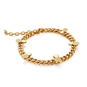 Gold stainless steel curb chain bracelet featuring pineapple charms and adjustable clasp