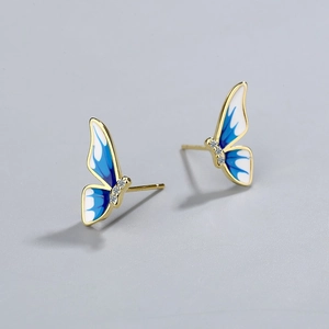 Golden butterfly stud earrings with blue gradient enamel wings and crystal rhinestones