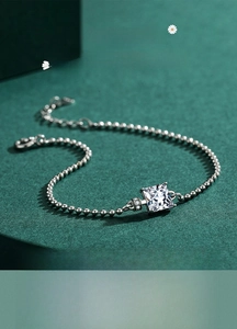 Detailed macro view of an S925 sterling silver beaded bracelet with a square zircon centerpiece