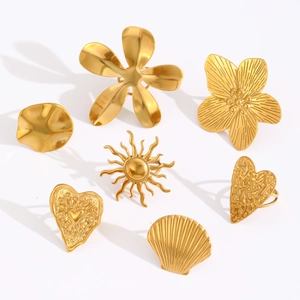7-piece gold stainless steel rings set featuring sun flower heart and wavy texture designs