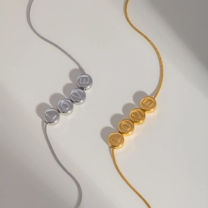 Gold and silver stainless steel snake chains with LOVE engraved bead pendants