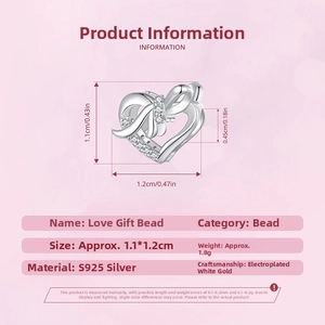 Detail view of heart bead charm in S925 silver with bow and cubic zirconia stones