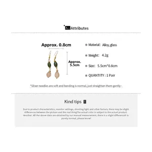 Detail view of water drop glass earrings with size measurements of 5.5cm by 0.8cm