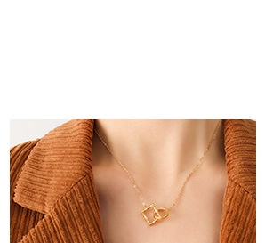 Close-up of a 18k gold-plated geometric interlocking circles necklace worn by a model