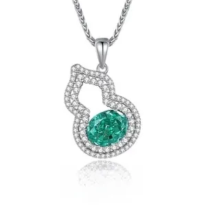 Close-up of S925 silver gourd pendant with hollow pave-set frame and oval green gemstone