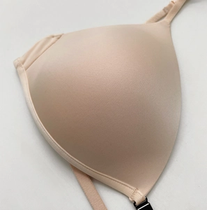 Close-up of seamless nude triangle bra with front closure and adjustable thin straps