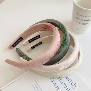 Padded wide headbands with ink painting embroidery and jacquard fabric textures