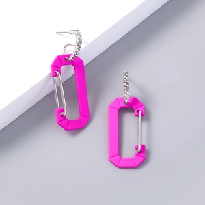 Detail of neon pink carabiner style drop earrings with sparkling rhinestone metal ring