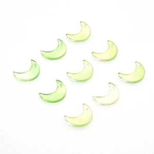 Detailed view of ten green gradient crescent moon glass charms for jewelry making