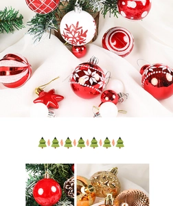 Close-up of red and gold Christmas ornaments with snowflake patterns and glitter details