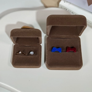 Macro detail of brown velvet jewelry boxes with soft flocking for rings and necklaces