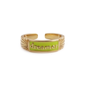 Detail of adjustable gold ring with light green enamel and dreamer embossed text