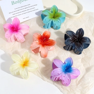 Colorful Y2K tropical frangipani flower hair claws in a variety of vibrant gradient colors