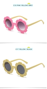 Detail view of flower-shaped kids' sunglasses in pink/yellow and all-yellow frames