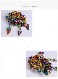 Macro view of luxury Baroque rose brooch with colorful rhinestones and teardrop pendants