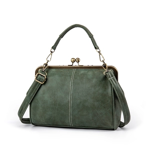 Vintage dark green frosted leather satchel bag with copper metal clasp and top handle