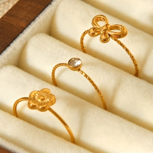 Three-piece 18K gold plated stainless steel ring set with floral and bow knot designs