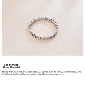Detailed top view of S925 sterling silver eternity band with colorful zircon stones