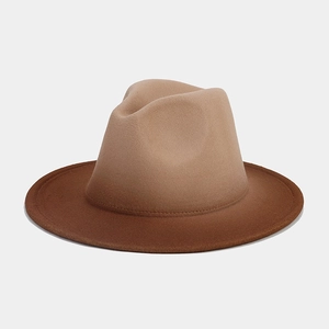 Flat lay of a gradient brown felt fedora hat with elegant transition on a grey background