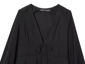 Flat lay of a black long-sleeved V-neck dress featuring a stylish front waist tie detail