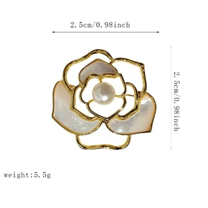 Macro detail of camellia brooch showing shell petals and 2.5cm diameter size