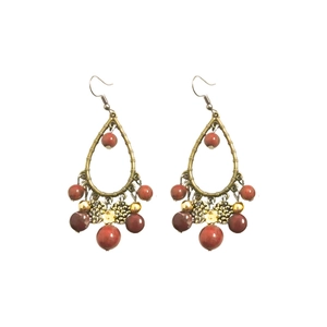 Vintage bohemian teardrop tassel earrings with bronze metal frame and ethnic bead details