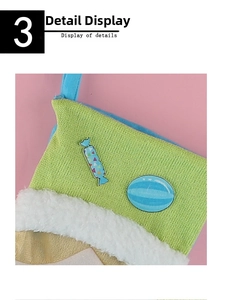 Detailed close-up of green knitted Christmas stocking with plush trim and candy patches