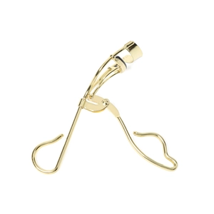 Golden carbon steel eyelash curler with black silicone pad on a clean white background