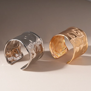 Minimalist wide hammered metal cuff bracelets in gold and silver finish with open design